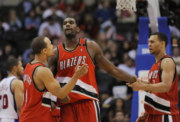 LOS ANGELES, CA - JANUARY 26: Greg Oden #52 of the Portland Trail Blazers celebrates with teammates Brandon Roy #7 and Jerryd Bayless #4 during their game against the Los Angeles Clippers at Staples Center January 26, 2009 in Los Angeles, California. NOTE TO USER: User expressly acknowledges and agrees that, by downloading and/or using this Photograph, user is consenting to the terms and conditions of the Getty Images License Agreement. (Photo by Kevork Djansezian/Getty Images)