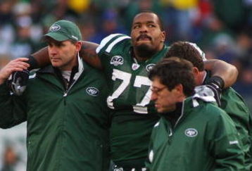 EAST RUTHERFORD, NJ - OCTOBER 18:  Kris Jenkins #77 of the New York Jets is helped off the field after being injured in the second quarter against the Buffalo Bills at Giants Stadium in the Meadowlands on October 18, 2009 in East Rutherford, New Jersey.  (Photo by Mike Stobe/Getty Images)