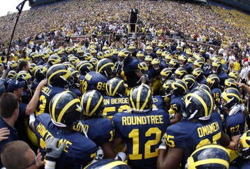 ANN ARBOR, MI - SEPTEMBER 5:  Michigan Wolverines players huddle before the game against the Western Michigan Broncos on September 5, 2009 at Michigan Stadium in Ann Arbor, Michigan. (Photo by Gregory Shamus/Getty Images)