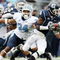EAST HARTFORD, CT - SEPTEMBER 12:  Jasper Howard #6 of the Connecticut Huskies carries the ball as Johnny White #34 of the North Carolinia Tar Heels tries to make the tackle on September 12, 2009 at Rentschler Field in East Hartford, Connecticut.  (Photo by Elsa/Getty Images)