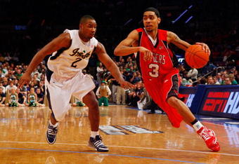 NEW YORK - MARCH 10:  Mike Rosario #3 of the Rutgers Scarlet Knights drives the ball against Tory Jackson #2 of the Notre Dame Fighting Irish during the first round of the Big East Tournament at Madison Square Garden on March 10, 2009 in New York City.  (Photo by Jim McIsaac/Getty Images)