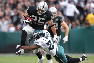 OAKLAND, CA - OCTOBER 18:  Justin Fargas #25 of the Oakland Raiders runs against Sheldon Brown #24 of the Philadelphia Eagles during an NFL game at the Oakland-Alameda County Coliseum on October 18, 2009 in Oakland, California.  (Photo by Jed Jacobsohn/Getty Images)