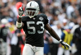 OAKLAND, CA - OCTOBER 18:  Thomas Howard #53 of the Oakland Raiders celebrates after a play against the Philadelphia Eagles during an NFL game at the Oakland-Alameda County Coliseum on October 18, 2009 in Oakland, California.  (Photo by Jed Jacobsohn/Getty Images)