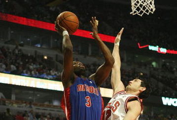CHICAGO - MARCH 24: Rodney Stuckey #3 of the Detroit Pistons puts up a shot under pressure from Kirk Hinrich #12 of the Chicago Bulls on March 24, 2009 at the United Center in Chicago, Illinois. The Bulls defeated the Pistons 99-91. NOTE TO USER: User expressly acknowledges and agreees that, by downloading and/or using this Photograph, User is consenting to the terms and conditions of the Getty Images License Agreement. (Photo by Jonathan Daniel/Getty Images)