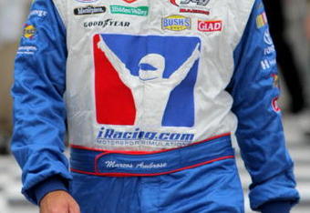 LONG POND, PA - AUGUST 02: Marcos Ambrose, driver of the #47 IRacing.com-Kingsford-Clorox Toyota, walks through pit road prior to the NASCAR Sprint Cup Series Sunoco Red Cross Pennsylvania 500 at the Pocono Raceway on August 2, 2009 in Long Pond, Pennsylvania.  (Photo by Doug Pensinger/Getty Images)