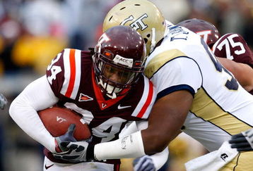 ATLANTA - OCTOBER 17:  Ryan Williams #34 of the Virginia Tech Hokies is tackled by T.J. Barnes #90 of the Georgia Tech Yellow Jackets at Bobby Dodd Stadium on October 17, 2009 in Atlanta, Georgia.  (Photo by Kevin C. Cox/Getty Images)