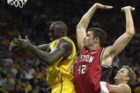 14 Nov 2001:  Forward Reggie Evans #32 of Iowa grabs a rebound in front of forward Ignacia Rodriguez #42 of Boston University in a game at the Guardians Classic in Iowa City Iowa. DIGITAL IMAGE Mandatory Credit: Jonathan Daniel/ALLSPORT