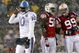 FOXBORO - OCTOBER 18: Vince Young #10 of the Tennessee Titans leaves the field as Pierre Woods #58 and Mike Wright #99 of the New England Patriots converse at Gillette Stadium on October 18, 2009 in Foxboro, Massachusetts. The Patriots won 59-0. (Photo by Jim Rogash/Getty Images)