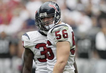 HOUSTON - OCTOBER 04:  Linebacker Brian Cushing #56 of the Houston Texans looks back at tight-end Zach Miller of her Oakland Raiders after delivering a hard hit in the fourth quarter at Reliant Stadium on October 4, 2009 in Houston, Texas.  (Photo by Bob Levey/Getty Images)