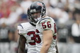 HOUSTON - OCTOBER 04:  Linebacker Brian Cushing #56 of the Houston Texans looks back at tight-end Zach Miller of her Oakland Raiders after delivering a hard hit in the fourth quarter at Reliant Stadium on October 4, 2009 in Houston, Texas.  (Photo by Bob Levey/Getty Images)