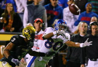 BOULDER, CO - OCTOBER 17: Dezmon Briscoe #80 of the Kansas Jayhawks reaches for a pass against Jimmy Smith #3 of the Colorado Buffaloes at Folsom Field on October 17, 2009 in Boulder, Colorado. (Photo by Garrett W. Ellwood/Getty Images)