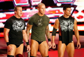 LAS VEGAS - AUGUST 24:  (L-R) Wrestlers Ted DiBiase, Randy Orton and Cody Rhodes appear during the WWE Monday Night Raw show at the Thomas & Mack Center August 24, 2009 in Las Vegas, Nevada.  (Photo by Ethan Miller/Getty Images)