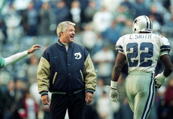 25 Nov 1999: Coach Jimmy Johnson of the Miami Dolphins talks to Emmitt Smith #22 of the Dallas Cowboys as he walks onto the field during the game at the Texas Stadium in Irving, Texas. The Cowboys defeated the Dolphins 20-0.