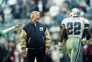 25 Nov 1999: Coach Jimmy Johnson of the Miami Dolphins talks to Emmitt Smith #22 of the Dallas Cowboys as he walks onto the field during the game at the Texas Stadium in Irving, Texas. The Cowboys defeated the Dolphins 20-0.
