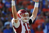 GAINESVILLE, FL - OCTOBER 17: Quarterback Ryan Mallett #15 of the Arkansas Razorbacks signals a touchdown against the Florida Gators October 17, 2009 at Ben Hill Griffin Stadium in Gainesville, Florida.  (Photo by Al Messerschmidt/Getty Images)