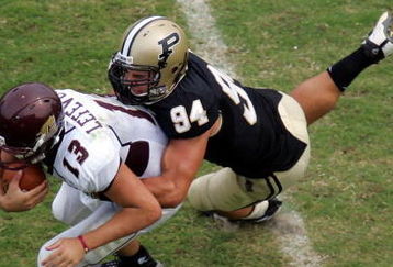 WEST LAFAYETTE, IN - SEPTEMBER 20:  Quarterback Dan LeFevour #13 of the Central Michigan Chippewas is tackled by Ryan Kerrigan #94 of the Purdue Boilermakers at Ross-Ade Stadium on September 20, 2008 in West Lafayette, Indiana.  (Photo by Ronald Martinez/Getty Images)