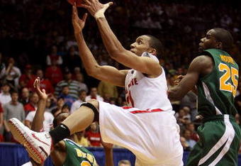 DAYTON, OH - MARCH 20: Evan Turner #21 of the Ohio State Buckeyes drives to the hoop against Edwin Ubiles #23 and Ronald Moore #25 of the Siena Saints during the first round of the NCAA Division I Men's Basketball Tournament at the University of Dayton Arena on March 20, 2009 in Dayton, Ohio.  (Photo by Andy Lyons/Getty Images)