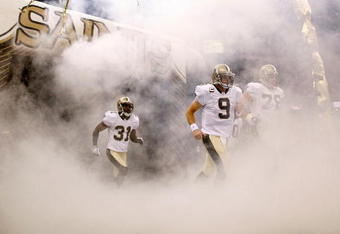 NEW ORLEANS - OCTOBER 18:  Drew Brees #9 of the New Orleans Saints runs onto the field during player introductions before playing the New York Giants at the Louisiana Superdome on October 18, 2009 in New Orleans, Louisiana.  (Photo by Chris Graythen/Getty Images)