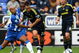 WIGAN, ENGLAND - SEPTEMBER 26: John Terry of Chelsea gets tackled by Marlon King of Wigan Athletic during the Barclays Premier League match between Wigan Athletic and Chelseaat JJB Stadium on September 26, 2009 in Wigan, England. (Photo by Phil Cole/Getty Images)