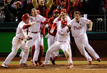 PHILADELPHIA - OCTOBER 19:  Carlos Ruiz #51 (C) of the Philadelphia Phillies celebrates with his teammates after he scored the winning run on a walkoff 2-run double by Jimmy Rollins #11 against the Los Angeles Dodgers in Game Four of the NLCS during the 2009 MLB Playoffs at Citizens Bank Park on October 19, 2009 in Philadelphia, Pennsylvania. The Phillies won 5-4.  (Photo by Jeff Zelevansky/Getty Images)