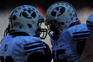 SAN DIEGO - OCTOBER 17:  Max Hall #15 and Jo Jo Pili #26 of BYU Cougars celebrate a touchdown against San Diego State Aztecs at Qualcomm Stadium on October 17, 2009 in San Diego, California.  (Photo by Jacob de Golish/Getty Images)
