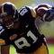 TAMPA, FL - JANUARY 01:  Tony Moeaki #81 of the Iowa Hawkeyes runs upfield as he fights off the tackle of Chris Culliver #17 of the South Carolina Gamecocks during the Outback Bowl on January 1, 2009 at Raymond James Stadium in Tampa, Florida.  (Photo by Scott Halleran/Getty Images)