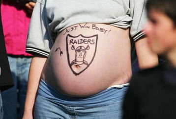 OAKLAND, CA - DECEMBER 5:  A devoted Raiders fan looks on during the game between the Oakland Raiders and the Kansas City Chiefs at Network Associates Coliseum on December 5, 2004 in Oakland, California.  (Photo by Jed Jacobsohn/Getty Images)