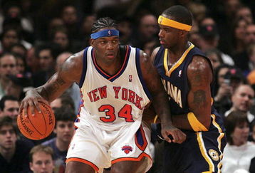 NEW YORK - NOVEMBER 04:  Eddie Curry #34 of the New York Knicks dribbles against Jermaine O'Neal #7 of the Indiana Pacers on November 4, 2006 at Madison Square Garden in New York City. NOTE TO USER: User expressly acknowledges and agrees that, by downloading and/or using this Photograph, User is consenting to the terms and conditions of the Getty Images License Agreement.  (Photo by Nick Laham/Getty Images)