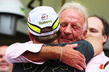 SAO PAULO, BRAZIL - OCTOBER 18:  Rubens Barrichello (L) of Brazil and Brawn GP is embraced by Jenson Buttons father John Button (R) after his son clinched the F1 World Drivers Championship during the Brazilian Formula One Grand Prix at the Interlagos Circuit on October 18, 2009 in Sao Paulo, Brazil.  (Photo by Mark Thompson/Getty Images)