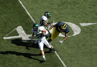 ANN ARBOR, MI - SEPTEMBER 19:  Safety Chris May #23 of the Eastern Michigan Eagles returns his interception against the Michigan Wolverines at Michigan Stadium on September 19, 2009 in Ann Arbor, Michigan.  Michigan won 45-17.  (Photo by Stephen Dunn/Getty Images)