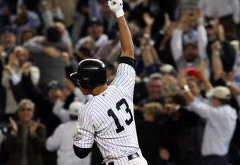 NEW YORK - OCTOBER 09:  Alex Rodriguez #13 of the New York Yankees celebrates after hitting a two run home run in the ninth inning against the Minnesota Twins in Game Two of the ALDS during the 2009 MLB Playoffs at Yankee Stadium on October 9, 2009 in the Bronx borough of New York City.  (Photo by Jim McIsaac/Getty Images)