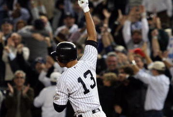 NEW YORK - OCTOBER 09:  Alex Rodriguez #13 of the New York Yankees celebrates after hitting a two run home run in the ninth inning against the Minnesota Twins in Game Two of the ALDS during the 2009 MLB Playoffs at Yankee Stadium on October 9, 2009 in the Bronx borough of New York City.  (Photo by Jim McIsaac/Getty Images)