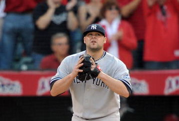 ANAHEIM, CA - OCTOBER 19:  Joba Chamberlain #62 of the New York Yankees reacts after giving up a sacrafice fly to Maicer Izturis #13 (Not Shown) of the Los Angeles Angels of Anaheim scoring Howie Kendrick #47 (Not Shown) during the seventh inning in Game Three of the ALCS during the 2009 MLB Playoffs at Angel Stadium on October 19, 2009 in Anaheim, California.  (Photo by Harry How/Getty Images)