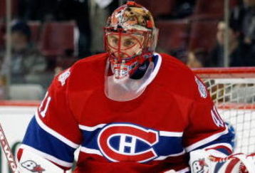 MONTREAL- APRIL 22:  Jaroslav Halak #41 of the Montreal Canadiens stops the puck during the warm up period prior to facing the Boston Bruins in Game Four of the Eastern Conference Quarterfinals of the 2009 Stanley Cup Playoffs at the Bell Centre on April 22, 2009 in Montreal, Quebec, Canada.  The Bruins defeated the Canadiens 4-1 winning the series 4-0.  (Photo by Richard Wolowicz/Getty Images)
