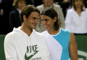 MALLORCA, SPAIN - MAY 2: Rafael Nadal of Spain and  Roger Federer of Switzerland share a joke after  the The Battle of the Surfaces between Rafael Nadal and Roger Federer at The Palma Arena on May 2, 2007 in Mallorca, Spain. (Photo by Clive Brunskill/Getty Images)