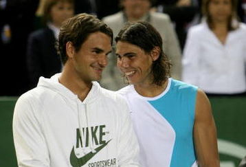 MALLORCA, SPAIN - MAY 2: Rafael Nadal of Spain and  Roger Federer of Switzerland share a joke after  the The Battle of the Surfaces between Rafael Nadal and Roger Federer at The Palma Arena on May 2, 2007 in Mallorca, Spain. (Photo by Clive Brunskill/Getty Images)