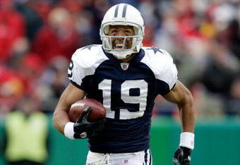 KANSAS CITY, MO - OCTOBER 11:  Miles Austin #19 of the Dallas Cowboys breaks a tackle and continues to the endzone for the first of his two touchdowns during the game against the Kansas City Chiefs on October 11, 2009 at Arrowhead Stadiumin Kansas City, Missouri.  (Photo by Jamie Squire/Getty Images)