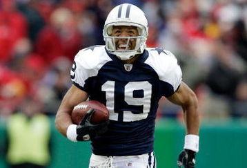 KANSAS CITY, MO - OCTOBER 11:  Miles Austin #19 of the Dallas Cowboys breaks a tackle and continues to the endzone for the first of his two touchdowns during the game against the Kansas City Chiefs on October 11, 2009 at Arrowhead Stadiumin Kansas City, Missouri.  (Photo by Jamie Squire/Getty Images)