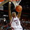 LAS VEGAS - MARCH 12:  Billy White #32 of the San Diego State Aztecs dunks next to Mareceo Rutledge #3 of the UNLV Rebels during a quarterfinal game of the Conoco Mountain West Conference Basketball Championships at the Thomas & Mack Center March 12, 2009 in Las Vegas, Nevada.  (Photo by Ethan Miller/Getty Images)