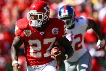 KANSAS CITY, MO - OCTOBER 04:  Running back Larry Johnson #27 of the Kansas City Chiefs carries the ball as Osi Umenyiora #72 of the New York Giants gives chase during the game on October 4, 2009 at Arrowhead Stadium in Kansas City, Missouri.  (Photo by Jamie Squire/Getty Images)