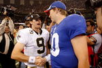 NEW ORLEANS - OCTOBER 18:  Drew Brees #9 of the New Orleans Saints is congratulated by Eli Manning #10 of the New York Giants after the Saints defeated the Giants 48-27  at the Louisiana Superdome on October 18, 2009 in New Orleans, Louisiana.  (Photo by Chris Graythen/Getty Images)
