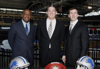 DETROIT , MI - JANUARY 16:  Jim Schwartz, center, head coach of the Detroit Lions poses with General Manager Martin Mayhew, left, and Tom Lewand team president after a press conference to introduce him as the Lions new head coach on January 16, 2009 at Ford Field in Detroit, Michigan.  (Photo by Gregory Shamus/Getty Images)