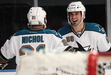 NEW YORK - OCTOBER 19: Brad Staubitz #59 of the San Jose Sharks celebrates his first goal of the season against the New York Rangers and is joined by Scott Nichol #21 at Madison Square Garden on October 19, 2009 in New York City. (Photo by Bruce Bennett/Getty Images)