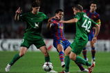 BARCELONA, SPAIN - OCTOBER 20:  Daniel Alves (C) of FC Barcelona duels for the ball with Cristian Ansaldi (L) and Rafal Murawski of FC Rubin Kazan during the UEFA Champions League group F match between FC Barcelona and FC Rubin Kazan at the Camp Nou Stadium on October 20, 2009 in Barcelona, Spain. FC Barcelona lost the match 2-1. (Photo by Jasper Juinen/Getty Images)
