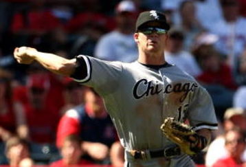 ANAHEIM, CA - SEPTEMBER 12: Third baseman Gordon Beckham #15 the Chicago White Sox throws out Torii Hunter of the Los Angeles Angels of Anaheim on a bunt in the sixth inning on September 12, 2009 at Angel Stadium in Anaheim, California.  The White Sox won 4-3 in 10 innings.  (Photo by Stephen Dunn/Getty Images)