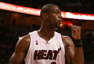 MIAMI - MAY 01:  Dwyane Wade #3 of the Miami Heat pumps his fist after the heat get a stop in the fourth quarter against the Atlanta Hawks during Game Six of the Eastern Conference Quarterfinals at American Airlines Arena on May 1, 2009 in Miami, Florida. The Heat defeated the Hawks 98-72. NOTE TO USER: User expressly acknowledges and agrees that, by downloading and/or using this Photograph, user is consenting to the terms and conditions of the Getty Images License Agreement.  (Photo by Doug Benc/Getty Images)