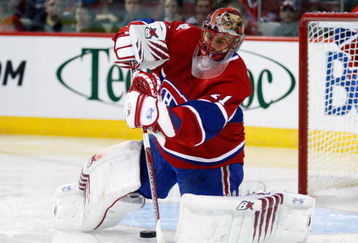 MONTREAL- SEPTEMBER 24:  Jaroslav Halak #41 of the Montreal Canadiens clears the puck during the NHL preseason game against the Boston Bruins on September 24, 2009 at the Bell Centre in Montreal, Quebec, Canada.  The Bruins defeated the Canadiens 2-1 in a shootout.  (Photo by Richard Wolowicz/Getty Images)