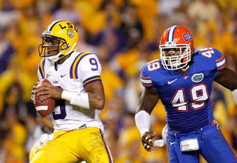 BATON ROUGE, LA - OCTOBER 10:  Jermaine Cunningham #49 of the Florida Gators against quarterback Jordan Jefferson #9 of the Louisiana State University Tigers at Tiger Stadium on October 10, 2009 in Baton Rouge, Louisiana.  (Photo by Kevin C. Cox/Getty Images)