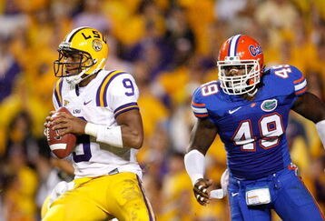 BATON ROUGE, LA - OCTOBER 10:  Jermaine Cunningham #49 of the Florida Gators against quarterback Jordan Jefferson #9 of the Louisiana State University Tigers at Tiger Stadium on October 10, 2009 in Baton Rouge, Louisiana.  (Photo by Kevin C. Cox/Getty Images)