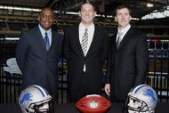 DETROIT , MI - JANUARY 16:  Jim Schwartz, center, head coach of the Detroit Lions poses with General Manager Martin Mayhew, left, and Tom Lewand team president after a press conference to introduce him as the Lions new head coach on January 16, 2009 at Ford Field in Detroit, Michigan.  (Photo by Gregory Shamus/Getty Images)